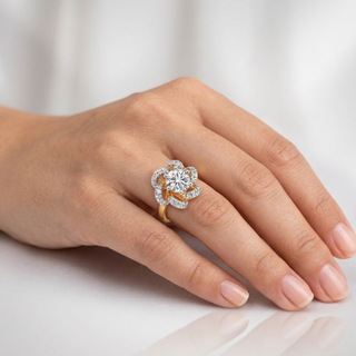Hand wearing a diamond ring on a light background, lab grown diamond in hyderabad
