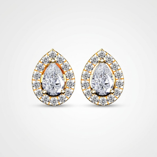 Pair of teardrop-shaped earrings with clear gemstones on a light gray background, lab grown diamond in hyderabad