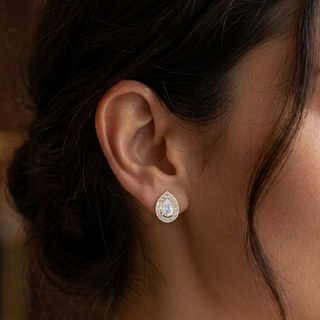 Close-up of an earring worn by a person with dark hair, lab grown diamond in Hyderabad