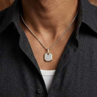 Necklace with a square pendant worn by a person in a dark shirt. lab grown diamond in hyderabad