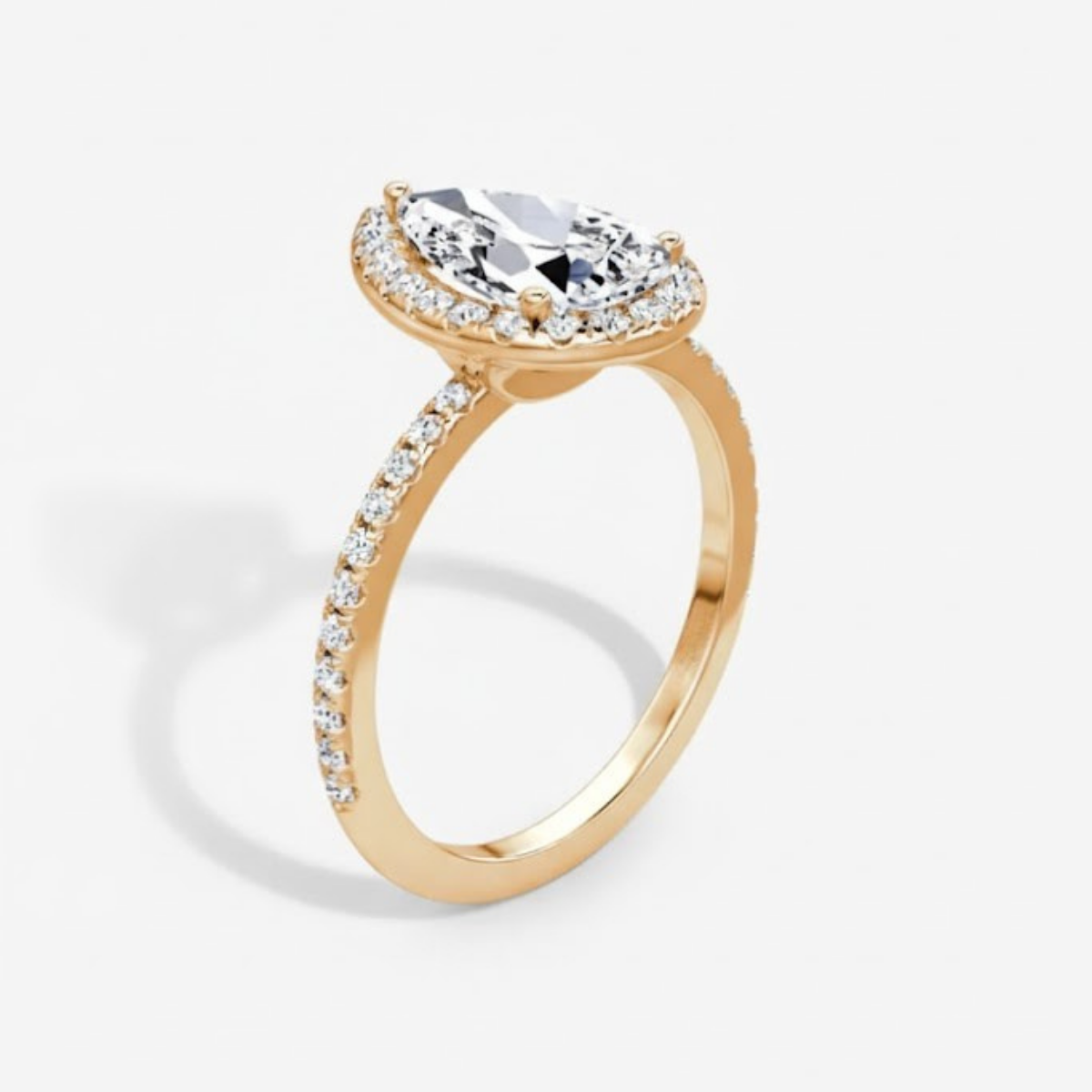 Angelica Pear Solitaire Pavé Ring with a Classic Halo