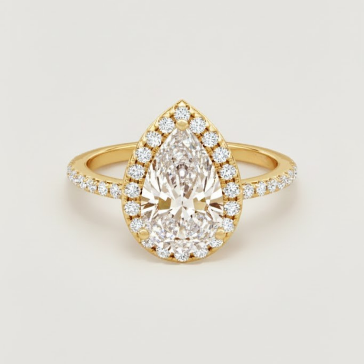 Angelica Classic Halo with a 1 Ct Pear Solitaire Pave Ring