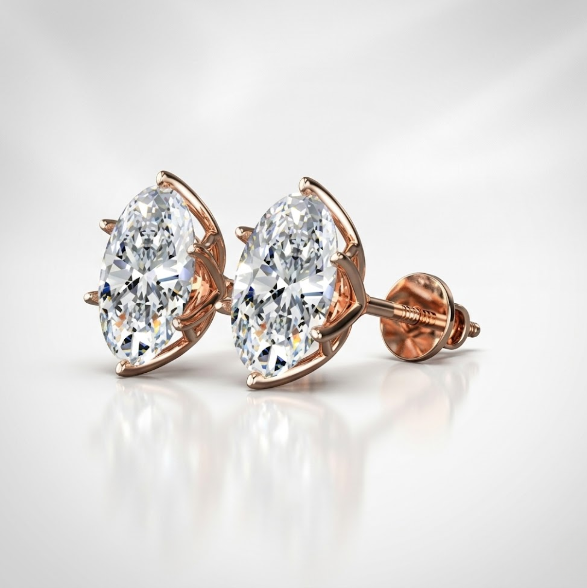 Rose gold earrings with large clear gemstones on a light gray background, lab grown diamond in Hyderabad