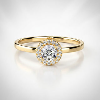 Gold ring with a diamond on a light gray background, lab grown diamond in hyderabad