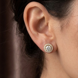 Close-up of an ear wearing a diamond earring with a blurred background, lab grown diamond in hyderabad