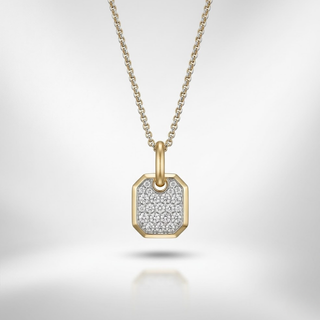 Gold necklace with a diamond-encrusted pendant on a light gray background, lab grown diamond in hyderabad