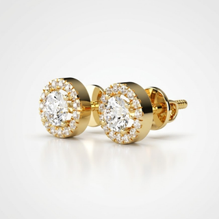 Gold earrings with clear gemstones on a light gray background, lab grown diamond in hyderabad