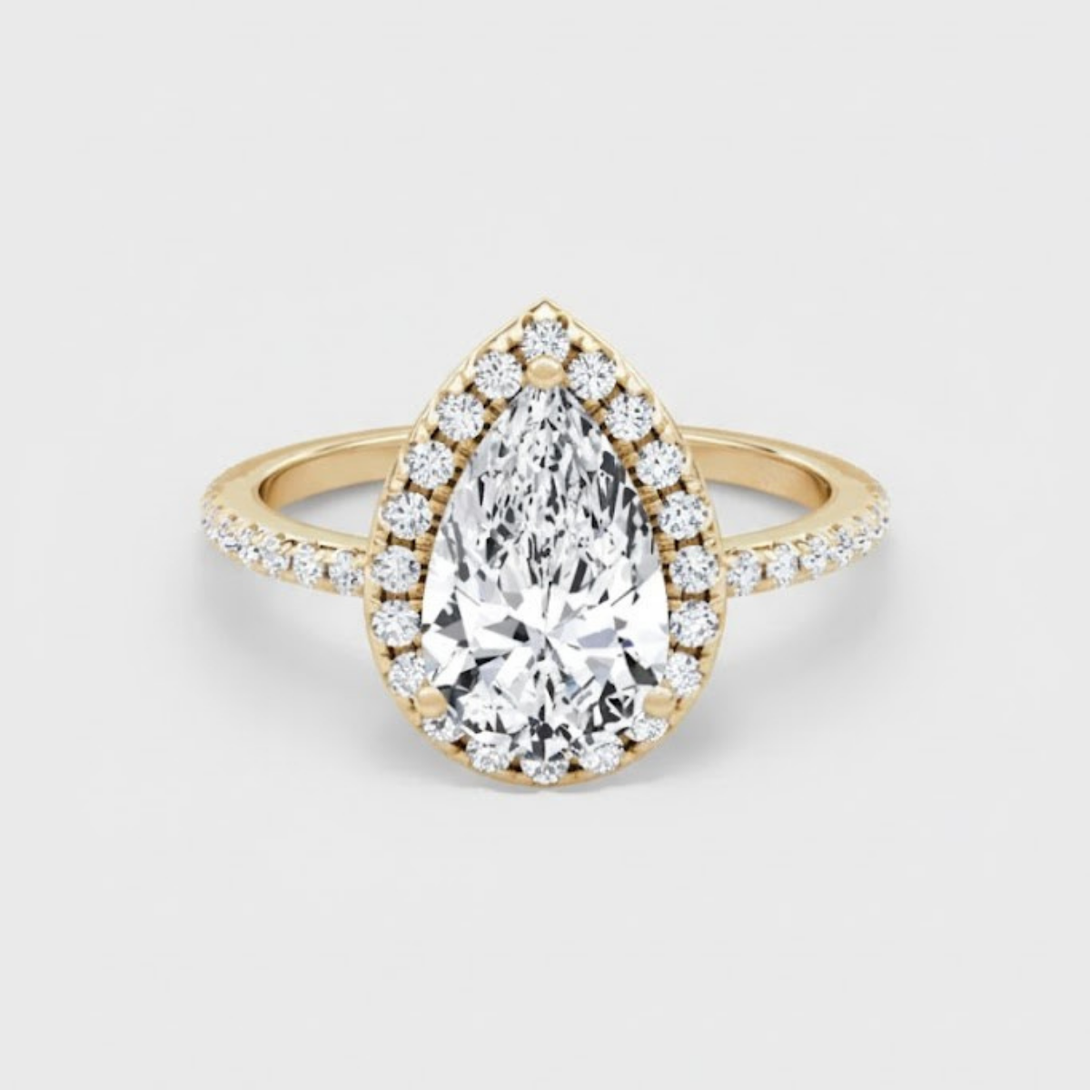 Angelica Pear Solitaire Pavé Ring with a Classic Halo