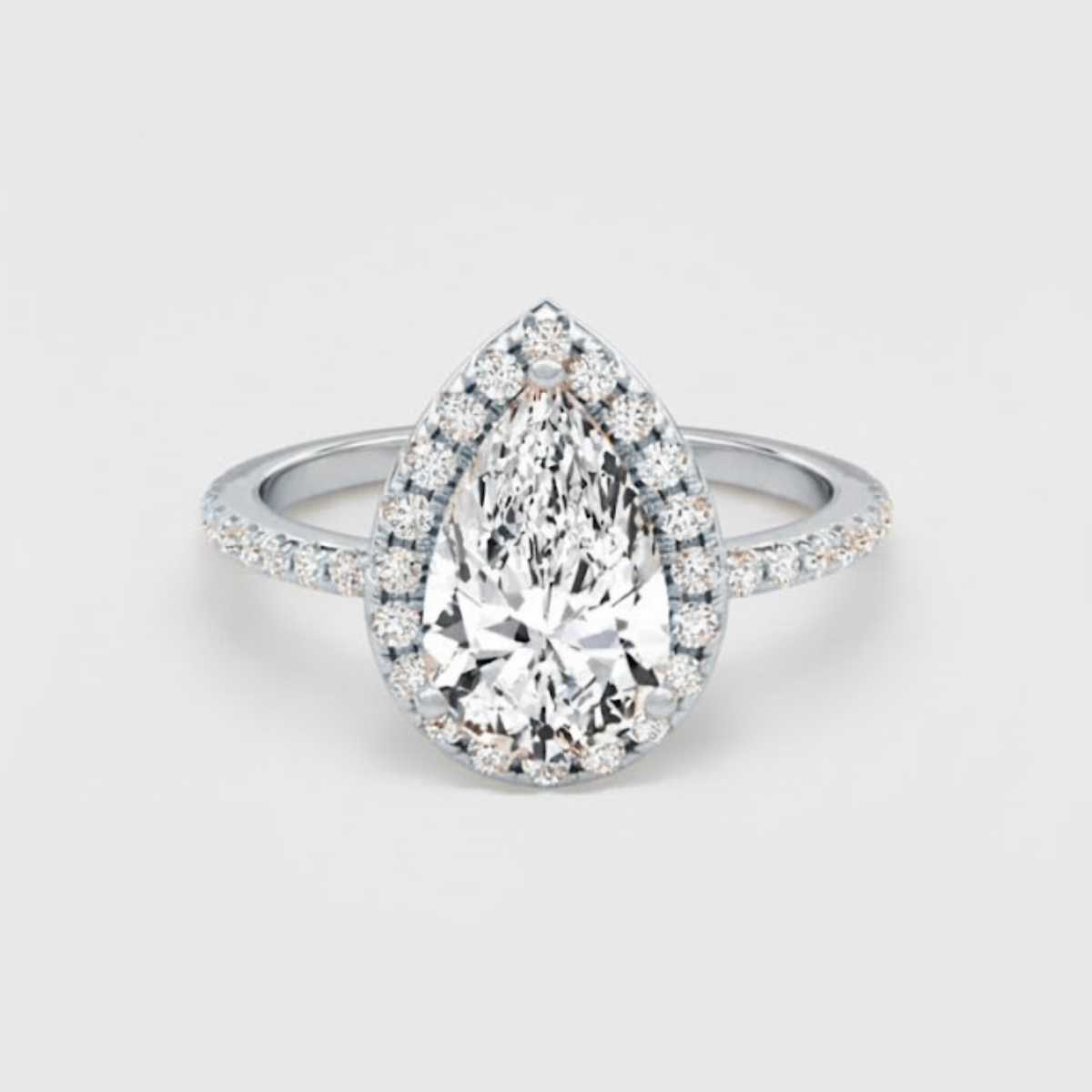 Angelica Pear Solitaire Pavé Ring with a Classic Halo