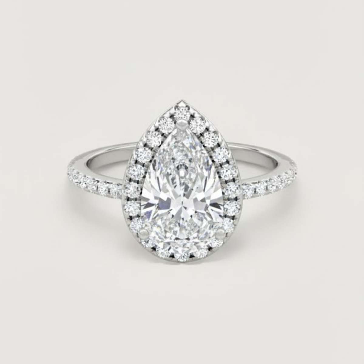 Angelica Classic Halo with a 1 Ct Pear Solitaire Pave Ring