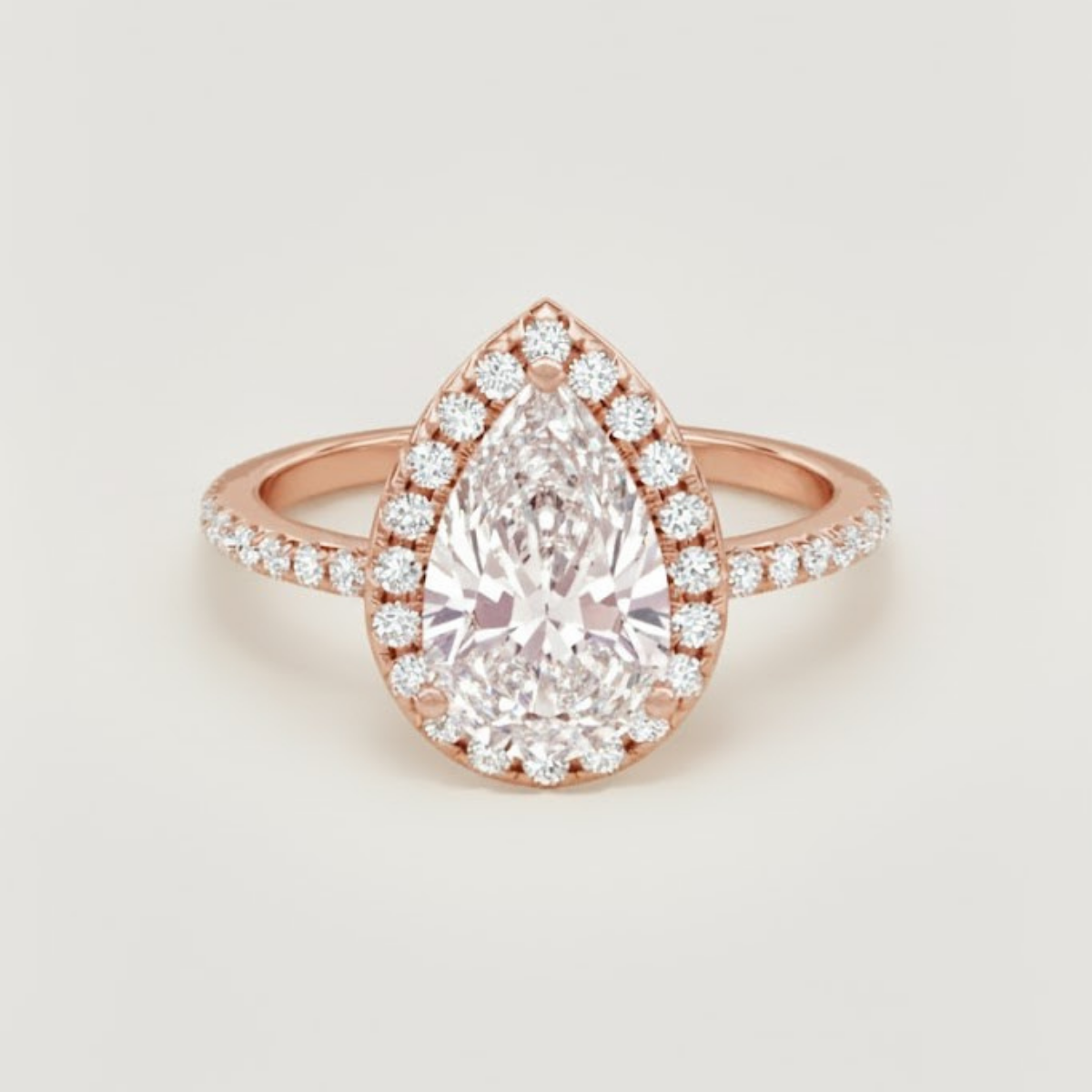 Angelica Classic Halo with a 1 Ct Pear Solitaire Pave Ring