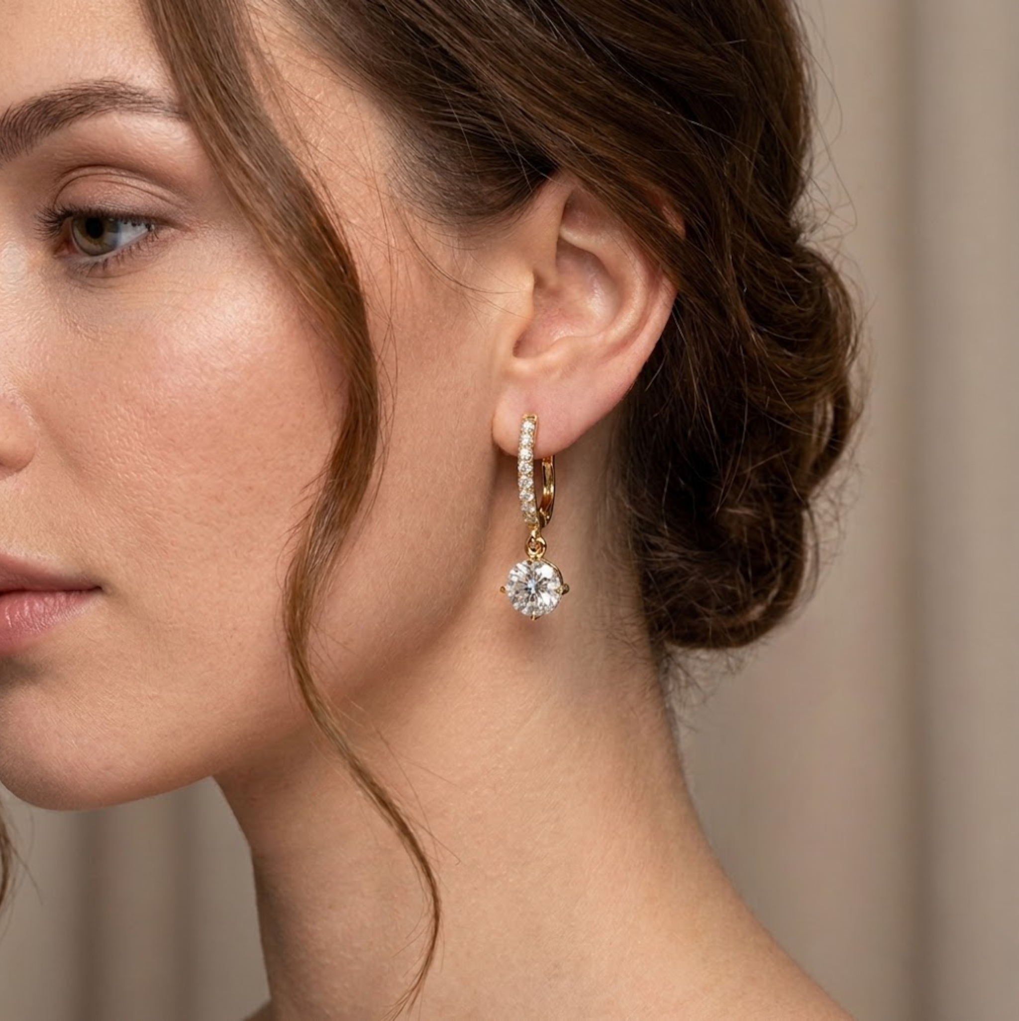 Close-up of a woman wearing a diamond earring with a blurred background, lab grown diamond in Hyderabad
