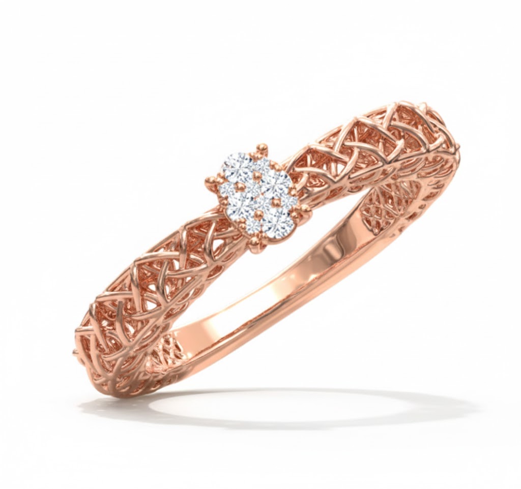 Rose gold ring with intricate design and diamond center on a white background